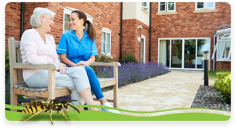 nurse and elderly woman sitting outside