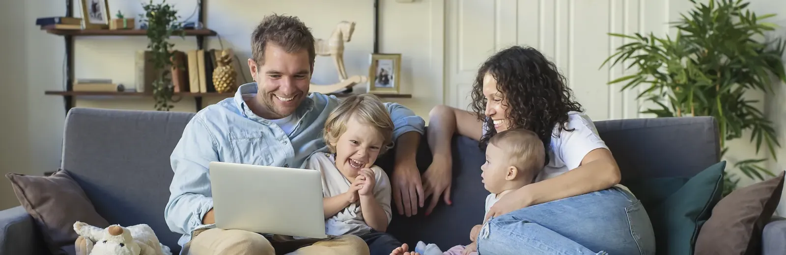 family sitting on couch